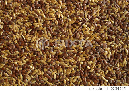 Mixed flax seeds macro texture brown and golden linseed 140254945