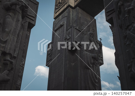 Dramatic Low Angle View of Monumental Stone Gateway with Historical Reliefs 140257047