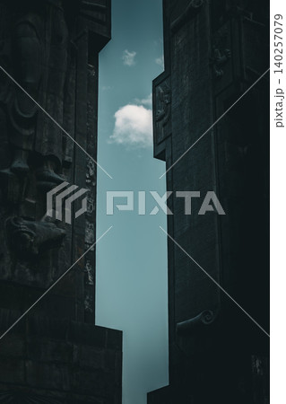 Dramatic Low Angle View of Monumental Stone Gateway with Historical Reliefs Dramatic Low Angle View of Monumental Stone Gateway with Historical Reliefs 140257079