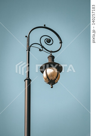 Vintage Ornamental Street Lamp Against Clear Blue Sky Vintage Ornamental Street Lamp Against Clear Blue Sky 140257183