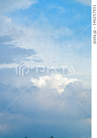 Big fluffy white clouds with the blue sky. Dramatic cloudscape. Nature scene. Nature background. Big fluffy white clouds with the blue sky. Dramatic cloudscape. Nature scene. Nature background. 140257931