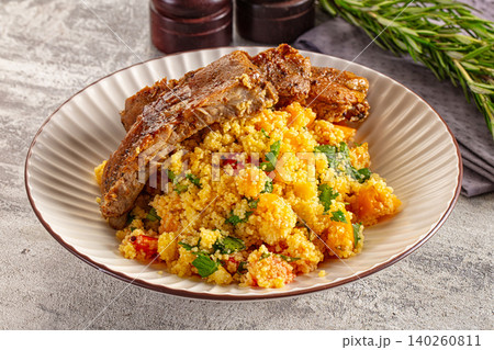 Grilled Lamb Ribs with Couscous Salad on Plate Grilled Lamb Ribs with Couscous Salad on Plate 140260811