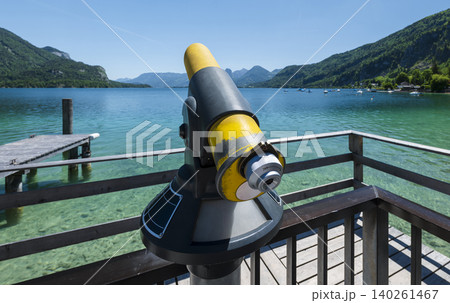 Coin operated telescope overlooking the scenic mountains and lake Wolfgangsee in the Austrian Alps, highlighting scenic viewpoint Coin operated telescope overlooking the scenic mountains and lake Wolfgangsee in the Austrian Alps, highlighting scenic viewpoint 140261467
