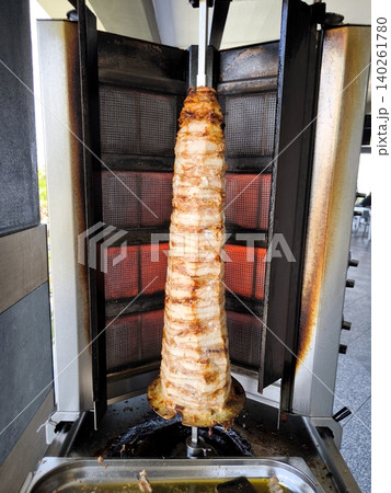 Preparing Chicken Doner Kebab on a Vertical Spit Preparing Chicken Doner Kebab on a Vertical Spit 140261780