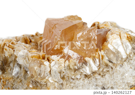 Macro mineral stone Scheelite on a white background Macro mineral stone Scheelite on a white background 140262127