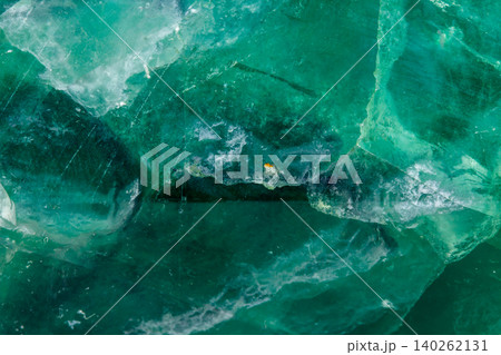 Macro mineral stone Fluorite crystal on a black background Macro mineral stone Fluorite crystal on a black background 140262131