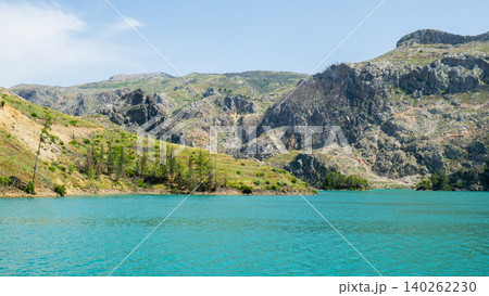 Panoramic Landscape view on green canyon Antalya Turkey with turquoise water mountain cliffs and green forest. Showcasing natural beauty travel tourist destination. Vacation concept Panoramic Landscape view on green canyon Antalya Turkey with turquoise water mountain cliffs and green forest. Showcasing natural beauty travel tourist destination. Vacation concept 140262230