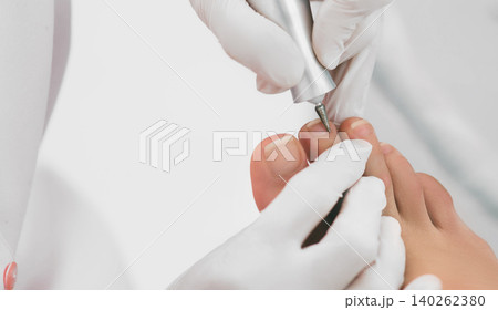 female legs close-up during a hardware manicure. Chiropodist service female legs close-up during a hardware manicure. Chiropodist service 140262380