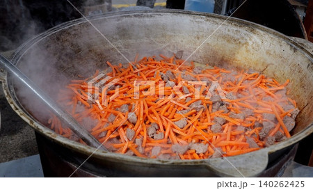 Festive veggie dishes, Holiday celebration with fresh vegetables, Seasonal event showcasing cooked and steamed vegetables, Festive occasion featuring brightly cooked carrots and steamed vegetable 140262425