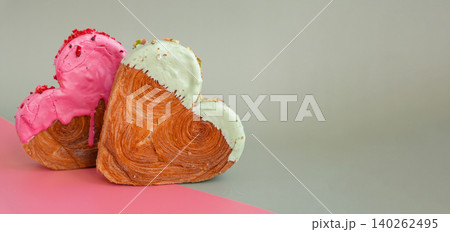 Two colored greeting card Valentine's Day Delicious fresh variety croissants topped with colorful flavor Ganache. Creation unique heart shape bakery. Puff pastry holiday love gift present idea 140262495