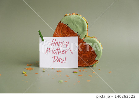HAPPY MOTHER'S DAY greeting card Delicious fresh croissant topped with Matcha Green Tea flavor Ganache. Creation unique heart shape bakery. Puff pastry holiday love gift present idea HAPPY MOTHER'S DAY greeting card Delicious fresh croissant topped with Matcha Green Tea flavor Ganache. Creation unique heart shape bakery. Puff pastry holiday love gift present idea 140262522