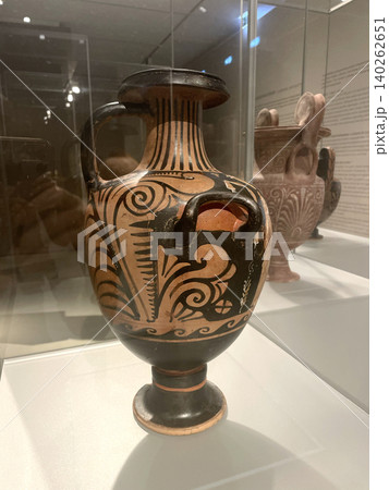 Ancient Greek Pottery Vase with Black-Figure Decoration in Museum Display Ancient Greek Pottery Vase with Black-Figure Decoration in Museum Display 140262651