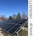 Solar Panel Installation with Evergreen Tree - Renewable Energy Photography 140262673