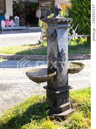 Ornate public drinking fountain with two basins in urban setting Ornate public drinking fountain with two basins in urban setting 140263137