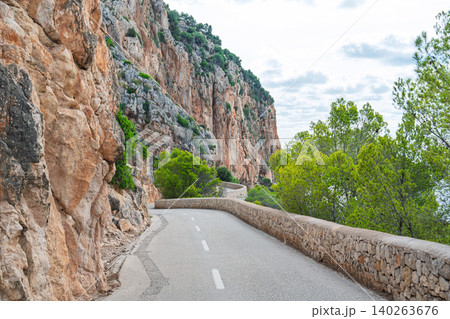 Scenic mountain road in Mallorca, Spain winding highway through the Tramuntana mountains Scenic mountain road in Mallorca, Spain winding highway through the Tramuntana mountains 140263676