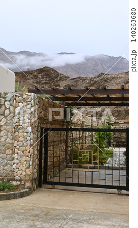 Quiet Landscape With Structures. Peaceful Scenery Featuring Stone Walls And Misty Peaks. Calm Early Morning Setting With Mountain Views And Secluded Architectural Features Quiet Landscape With Structures. Peaceful Scenery Featuring Stone Walls And Misty Peaks. Calm Early Morning Setting With Mountain Views And Secluded Architectural Features 140263680