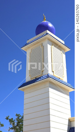 Majestic Minaret Features Detailed Ceramic Decorations Beautifully. Vivid Blue Minaret Decorated With Complex Ceramic Patterns Highlights Craftsmanship And Visual Appeal Majestic Minaret Features Detailed Ceramic Decorations Beautifully. Vivid Blue Minaret Decorated With Complex Ceramic Patterns Highlights Craftsmanship And Visual Appeal 140263760