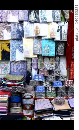 Elegant Asian Textile Arrangements Featuring Layered Patterns And Subtle Hues. Showcase Of Intricate Fabric Designs With Hanging Silhouettes And Gentle Color Palettes 140263821
