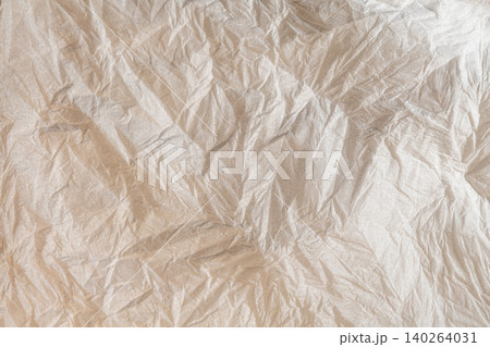 Wrinkled textured kraft paper surface with creased folds pattern Wrinkled textured kraft paper surface with creased folds pattern 140264031