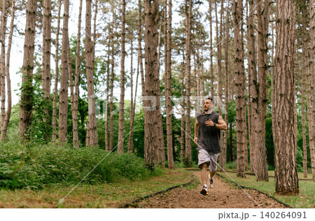 Trail Running Workout In Pine Forest 140264091