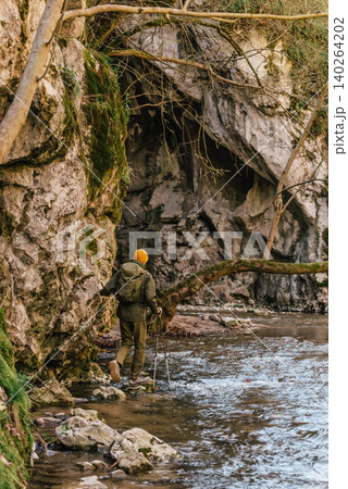 Male Explorer Crossing Forest River Male Explorer Crossing Forest River 140264202