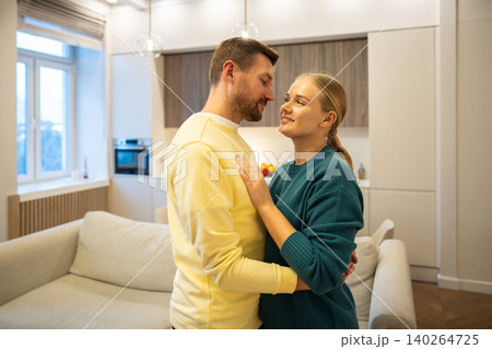 Cheerful man and woman looking at each other and smiling, enjoying bonding in relationships 140264725