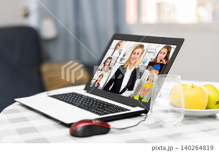 Laptop with image of people participating in video conference closeup Laptop with image of people participating in video conference closeup 140264819