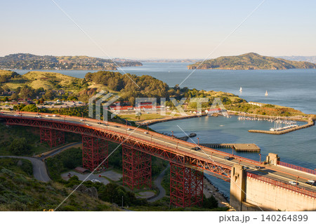 Golden Gate Bridge roadway above coastal park and San Francisco Bay 140264899