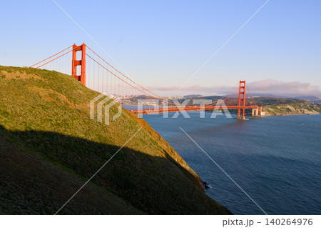 Golden Gate Bridge emerging from Marin Headlands at sunset Golden Gate Bridge emerging from Marin Headlands at sunset 140264976