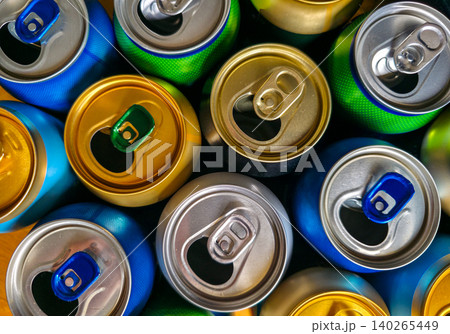 Colorful used metal beverage cans close-up. Concept of collection, recycling, and reuse of packaging. High quality photo Colorful used metal beverage cans close-up. Concept of collection, recycling, and reuse of packaging. High quality photo 140265449