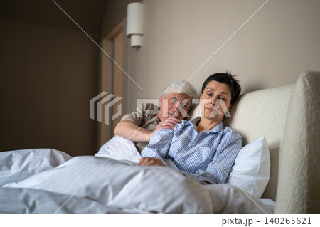 Apathetic disappointed senior wife ignoring elderly husband approaches to make peace after quarrel. 140265621