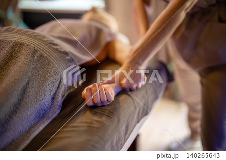 Woman relaxing in spa salon and getting arms massage, professional beauty treatment for body health. 140265643
