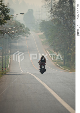 Northern Thailand suffering from dry season and heavy mountain fires, smog and smoke covering roads. Northern Thailand suffering from dry season and heavy mountain fires, smog and smoke covering roads. 140265676