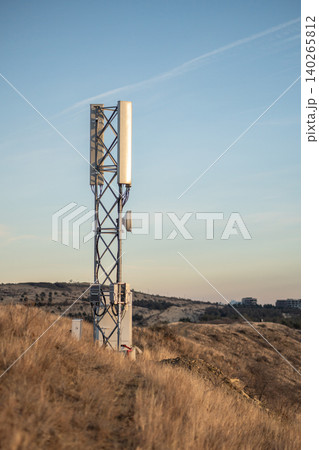 Cell 5G tower in mountains, cellular base station with mobile antenna transmits signals. Cell 5G tower in mountains, cellular base station with mobile antenna transmits signals. 140265812