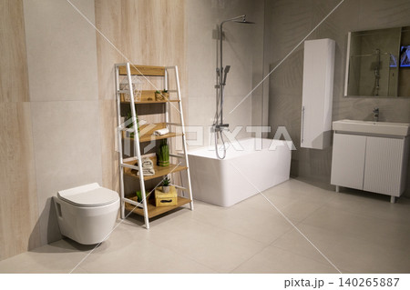 Modern Bathroom Interior with Freestanding Bathtub and Wooden Ladder Shelf Modern Bathroom Interior with Freestanding Bathtub and Wooden Ladder Shelf 140265887