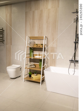 Modern Bathroom Interior with Freestanding Bathtub and Wooden Ladder Shelf Modern Bathroom Interior with Freestanding Bathtub and Wooden Ladder Shelf 140265890