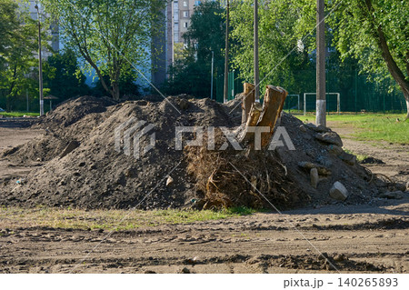 Pile of removed earthen ground debris garbage before laying asphalt Pile of removed earthen ground debris garbage before laying asphalt 140265893