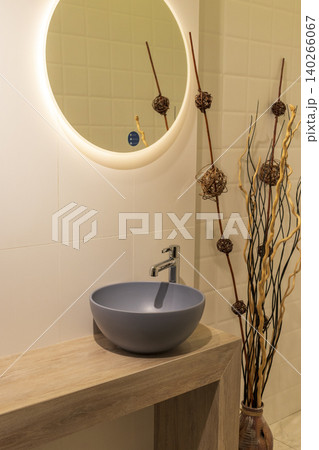 Contemporary Restroom Decor Featuring Ceramic Sink and Textured Geometric Wall Contemporary Restroom Decor Featuring Ceramic Sink and Textured Geometric Wall 140266067