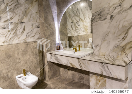 Contemporary Restroom Decor Featuring Ceramic Sink and Textured Geometric Wall Contemporary Restroom Decor Featuring Ceramic Sink and Textured Geometric Wall 140266077