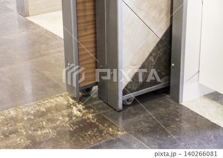 Sliding Ceramic Tile Display Rack on Wheels in Showroom Store Sliding Ceramic Tile Display Rack on Wheels in Showroom Store 140266081