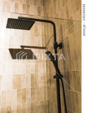 Modern Bathroom Shower Stall Setup with Textured Beige Vertical Tiles Modern Bathroom Shower Stall Setup with Textured Beige Vertical Tiles 140266098