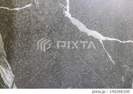 Charcoal Granite Stone Surface with Detailed Mineral Quartz Lines Charcoal Granite Stone Surface with Detailed Mineral Quartz Lines 140266100