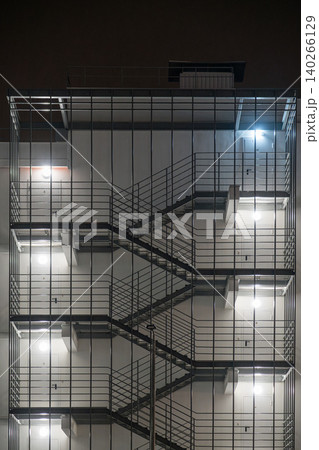 Staircase design on a building at night in a city Staircase design on a building at night in a city 140266129