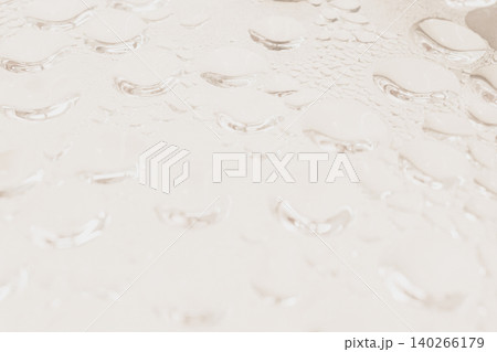 Top up abstract view of clean water drops and condensation steam on a transparent glass surface, creating a bright warm bubble texture backdrop or template Top up abstract view of clean water drops and condensation steam on a transparent glass surface, creating a bright warm bubble texture backdrop or template 140266179