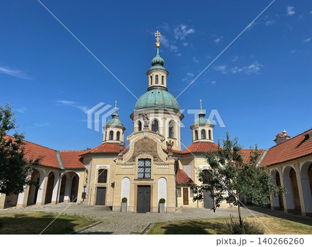 Historic church building with domed roof and blue sky backdrop Historic church building with domed roof and blue sky backdrop 140266260