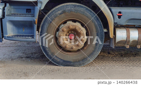 A truck wheel in a parking lot during operation 140266438