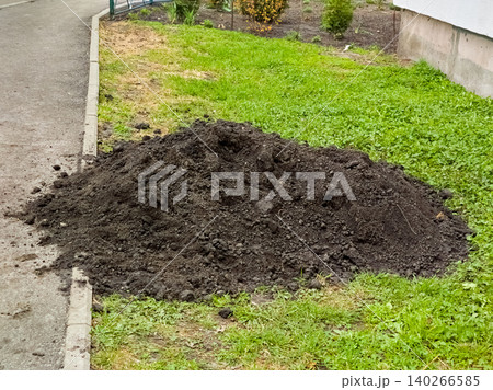 Landscaping.A pile of fertile soil for adding to lawns Landscaping.A pile of fertile soil for adding to lawns 140266585