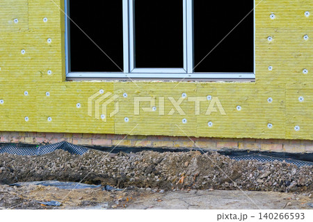 Construction site.Thermal insulation panels on wall with window Construction site.Thermal insulation panels on wall with window 140266593
