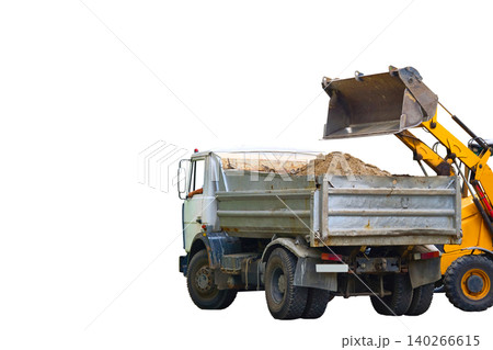 Construction moment.Loading road debris with an excavator into dump truck Construction moment.Loading road debris with an excavator into dump truck 140266615