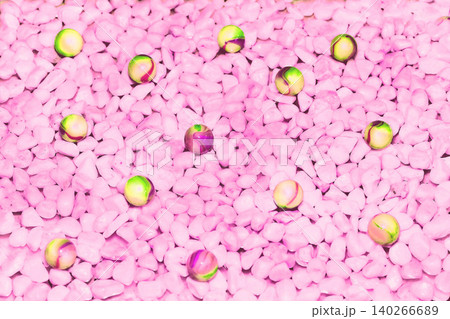 Pink stones,glass gem green yellow balls background 140266689